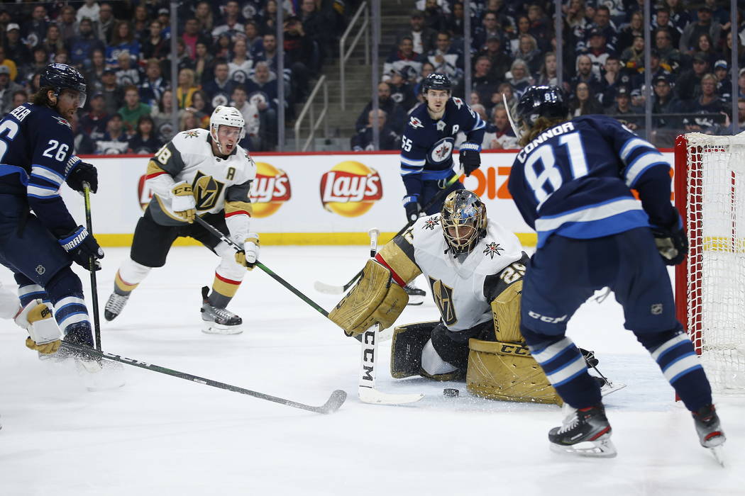Vegas Golden Knights goaltender Marc-Andre Fleury (29) stops the shot from Winnipeg Jets' Kyle ...