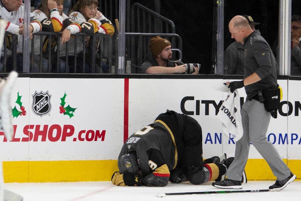 Vegas Golden Knights center Cody Glass (9) crouches in pain during the second period of the gam ...