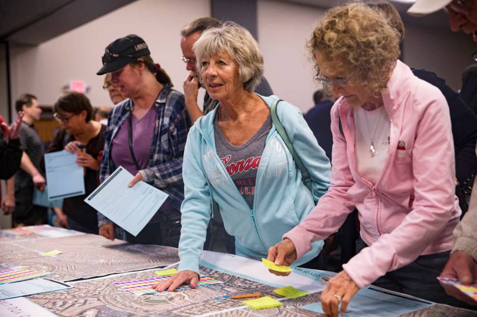 Lois Anderson speaks with city officials at a meeting the city hosted to provide information an ...