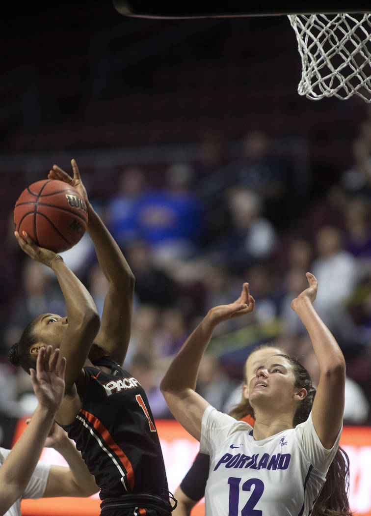 University of the Pacific's forward Brooklyn McDavid (1) shoots a point as University of Portla ...