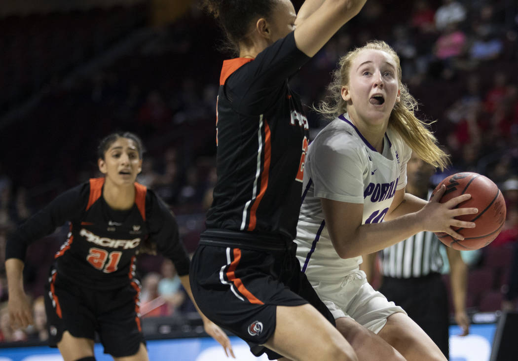 University of Portland's guard Haylee Andrews (10) eyes the hoop as University of the Pacific's ...