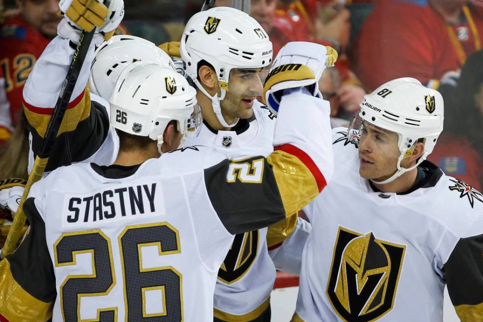 Vegas Golden Knights' Max Pacioretty, center, celebrates his goal with teammates Paul Stastny, ...