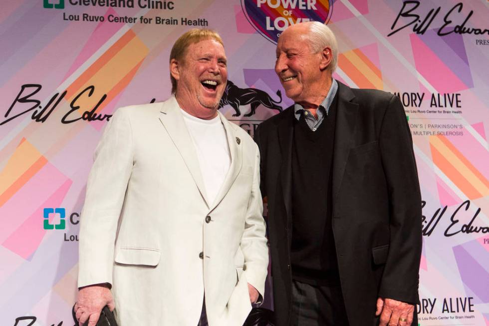 Oakland Raiders owner Mark Davis, left, poses with former Raiders player and coach Fred Biletni ...