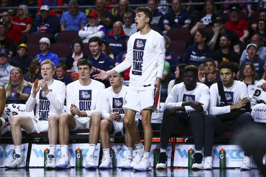 Gonzaga Bulldogs' Will Graves, center, reacts during the second half of a West Coast Conference ...