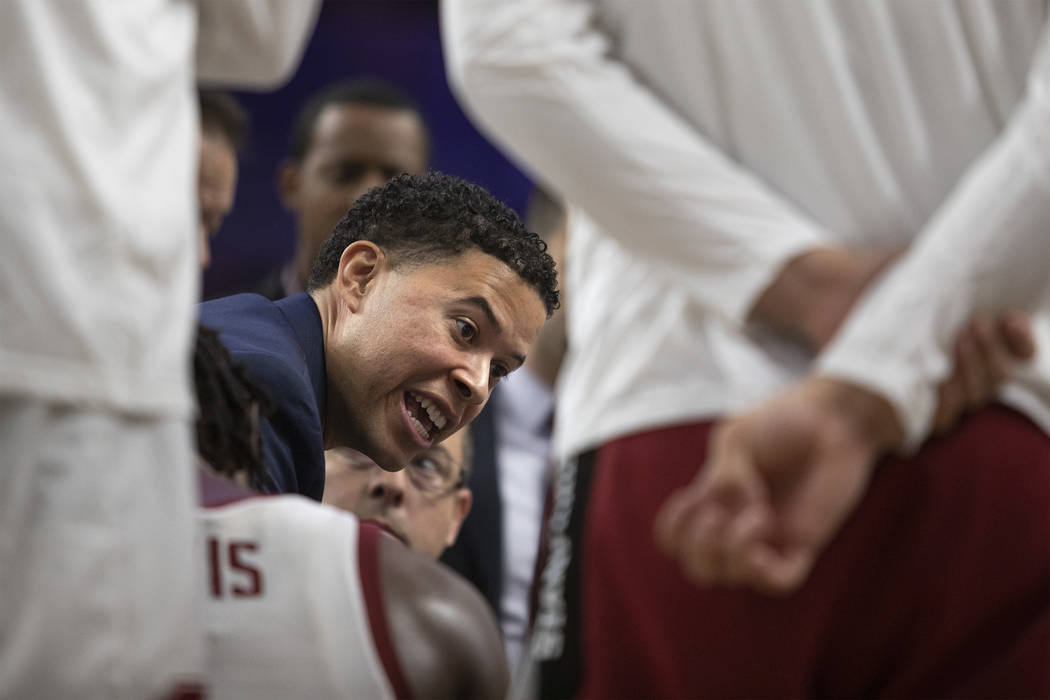 Stanford assistant coach Jesse Pruitt speaks to the team during a timeout at the game against U ...