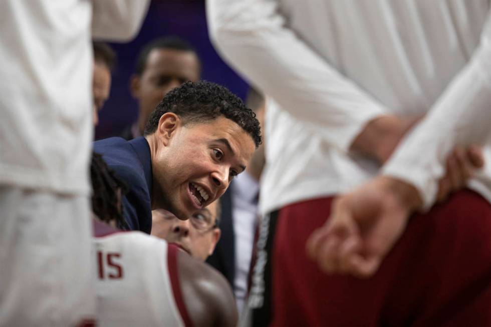 Stanford assistant coach Jesse Pruitt speaks to the team during a timeout at the game against U ...