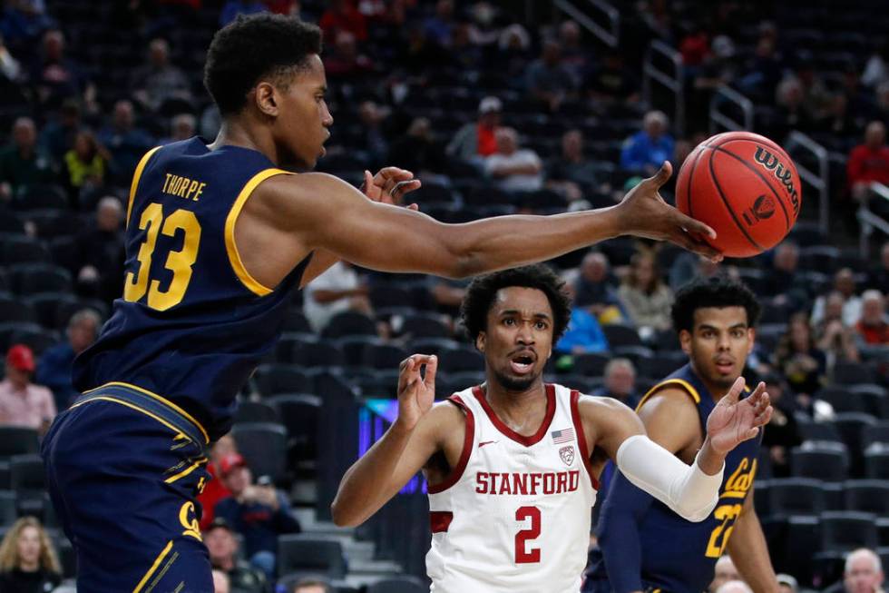 California's D.J. Thorpe (33) passes around Stanford's Bryce Wills (2) during the second half o ...