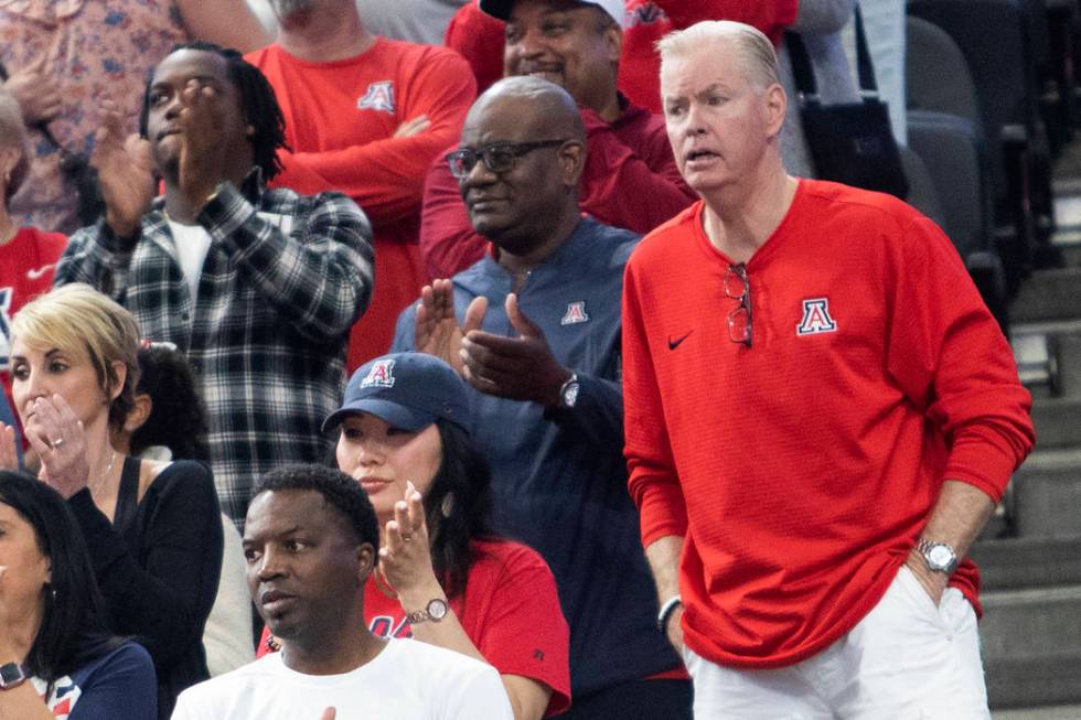 Pace Mannion, who went to Chaparral High School, watches his son, Nico Mannion, play basketball ...