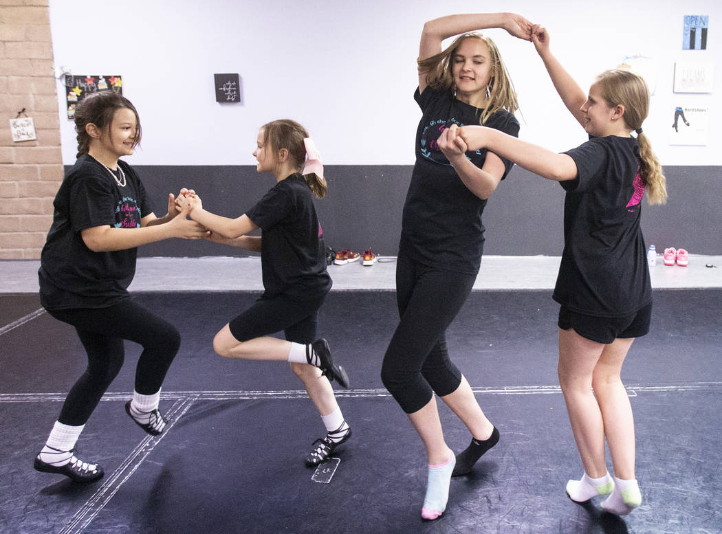 Makayla Patterson, left, Alli Kano, Cian Monaghan and Maren Smith practice at Scoil Rince Ni R ...