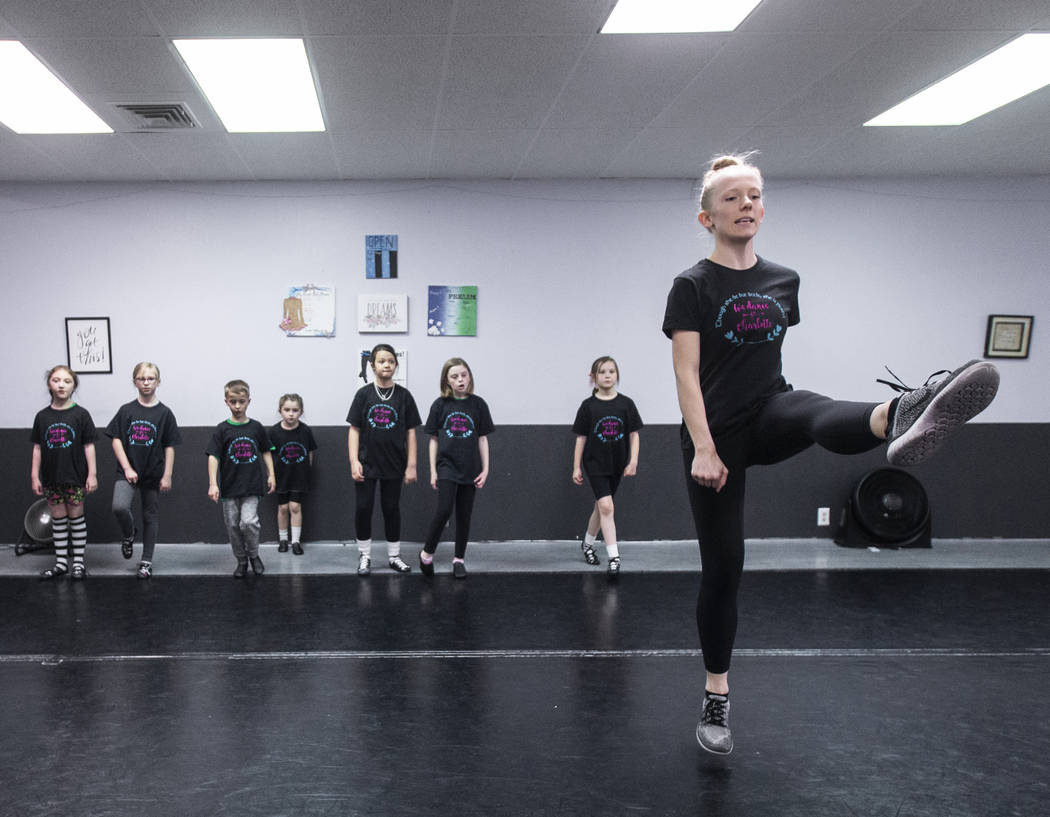 Instructor Tara Reid, right, teaches students at Scoil Rince Ni Riada Irish Dance on Wednesday, ...