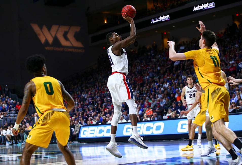 Gonzaga Bulldogs' Joel Ayayi (11) shoots over San Francisco Dons' Remu Raitanen (11) during the ...