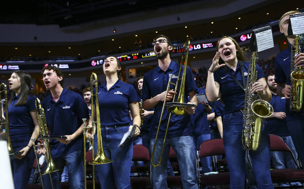 Members of the Gonzaga band sing along to music during the first half of a West Coast Conferenc ...