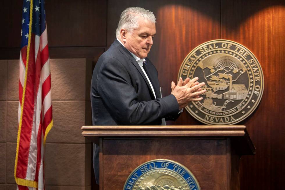 Gov. Steve Sisolak uses hand sanitizer before a press briefing on the new coronavirus case in N ...