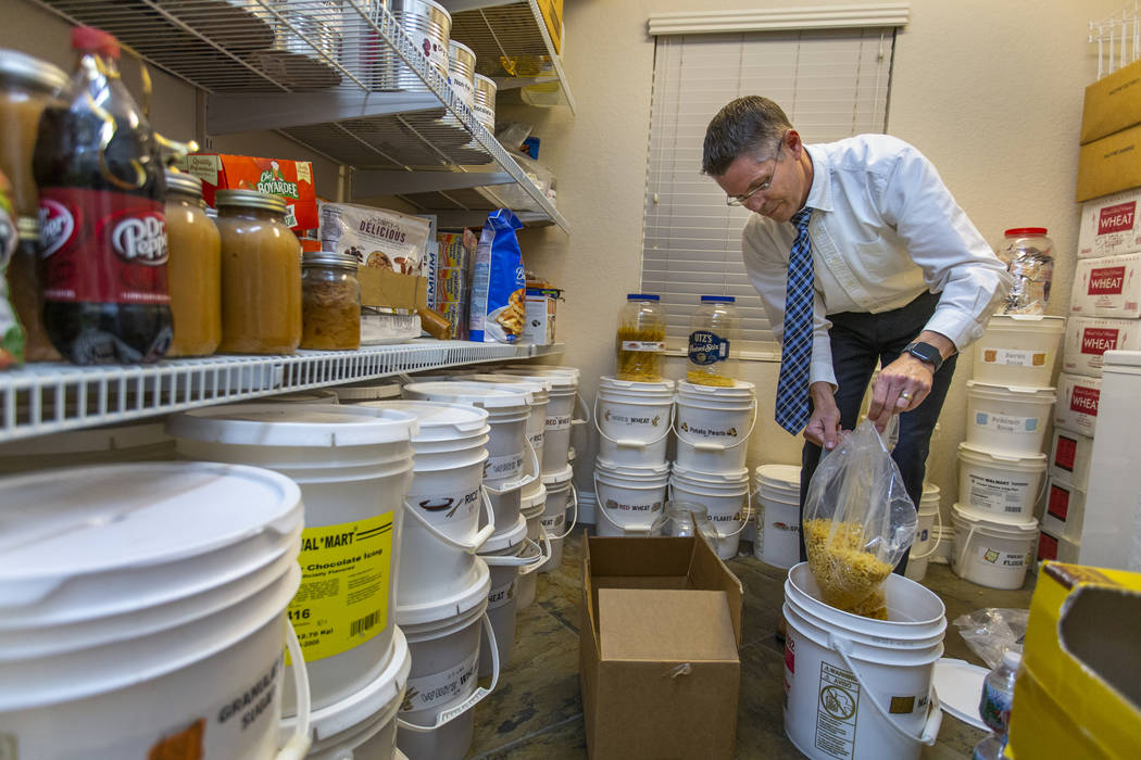 Cory Steed restocks macaroni as part of the food items stored in their home pantry on Monday, M ...