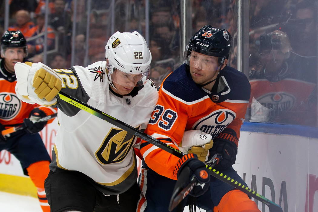 Edmonton Oilers' Alex Chiasson (39) jostles with Vegas Golden Knights' Nick Holden (22) during ...