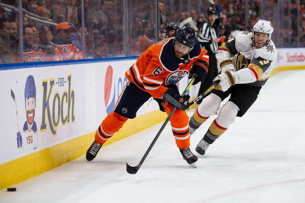 Edmonton Oilers' Adam Larsson (6) is pursued by Vegas Golden Knights' Brayden McNabb (3) during ...