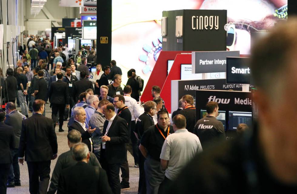 Showgoers arrive at the National Association of Broadcasters (NAB) show at the Las Vegas Conven ...