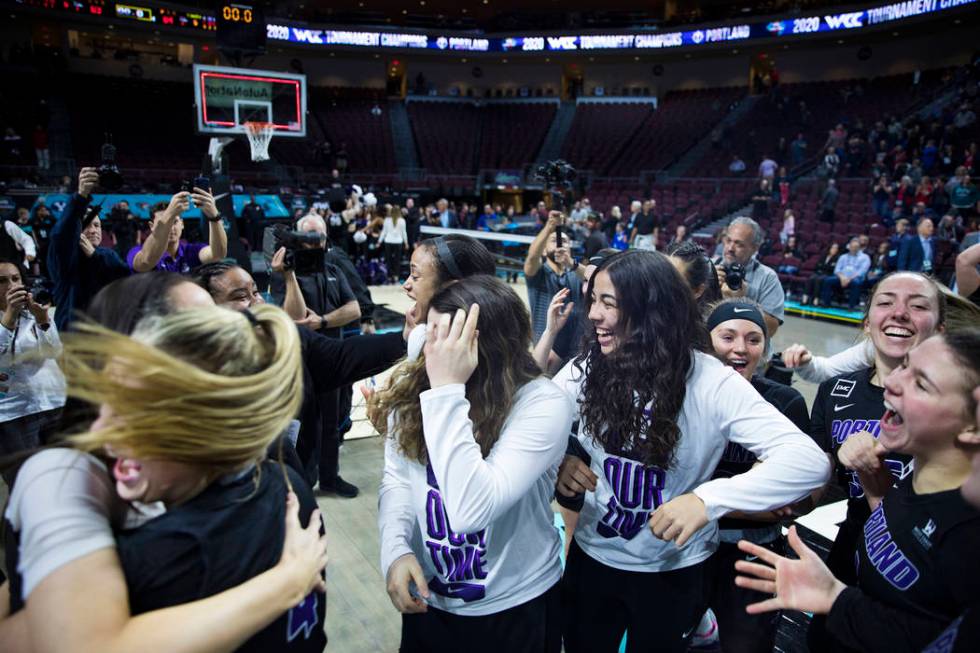 The Portland Pilots celebrate after winning the West Coast Conference championship against the ...