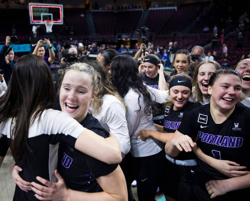 The Portland Pilots celebrate after winning the West Coast Conference championship against the ...