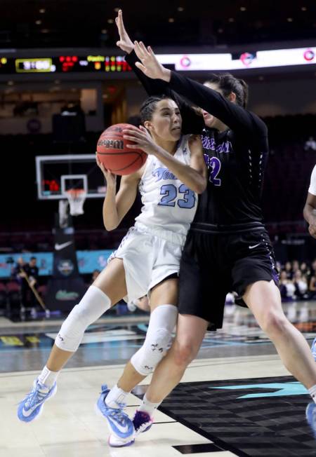 San Diego Toreros Jordyn Edwards (23) tries to push past Portland Pilots Alex Fowler (12) in th ...