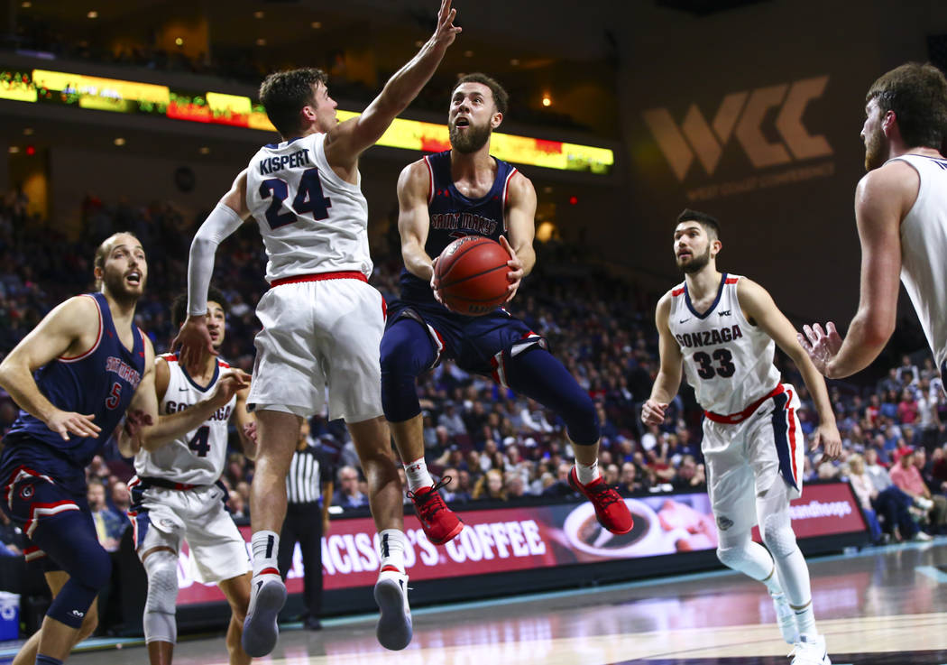 St. Mary's Gaels' Jordan Ford (3) goes to the basket against Gonzaga Bulldogs' Corey Kispert (2 ...