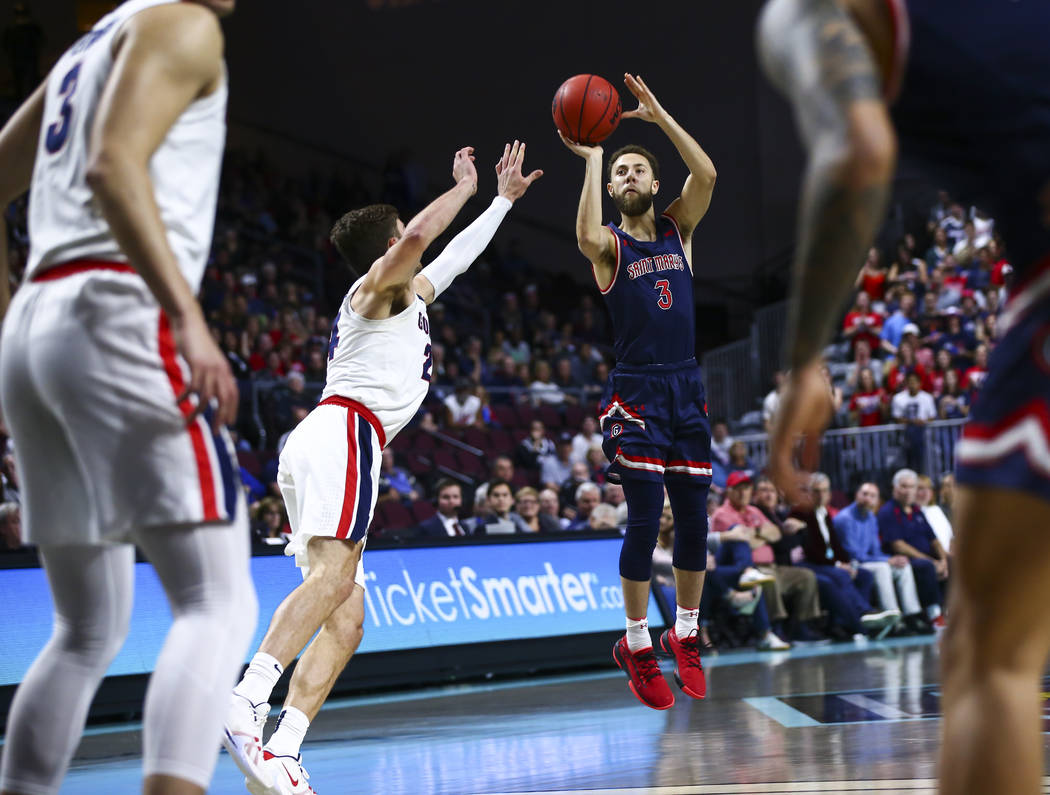 St. Mary's Gaels' Jordan Ford (3) shoots over Gonzaga Bulldogs' Corey Kispert (24) during the f ...