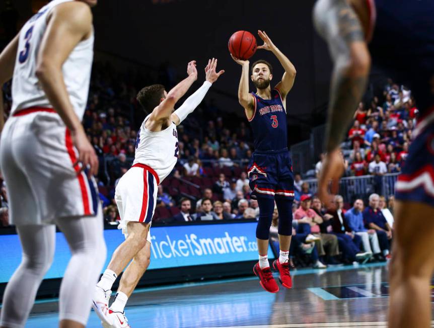 St. Mary's Gaels' Jordan Ford (3) shoots over Gonzaga Bulldogs' Corey Kispert (24) during the f ...