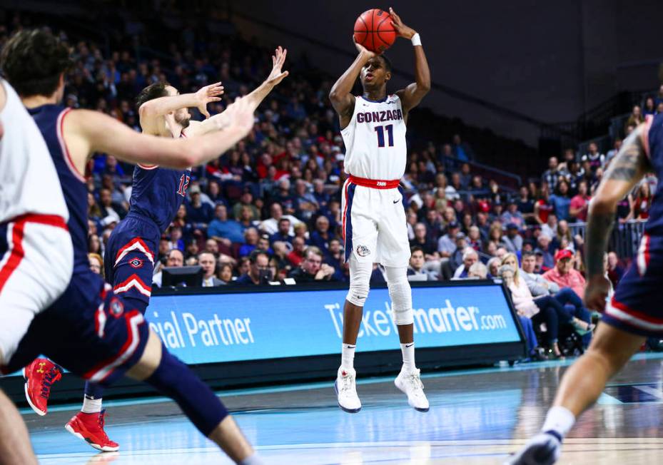 Gonzaga Bulldogs' Joel Ayayi (11) shoots against the St. Mary's Gaels during the second half of ...