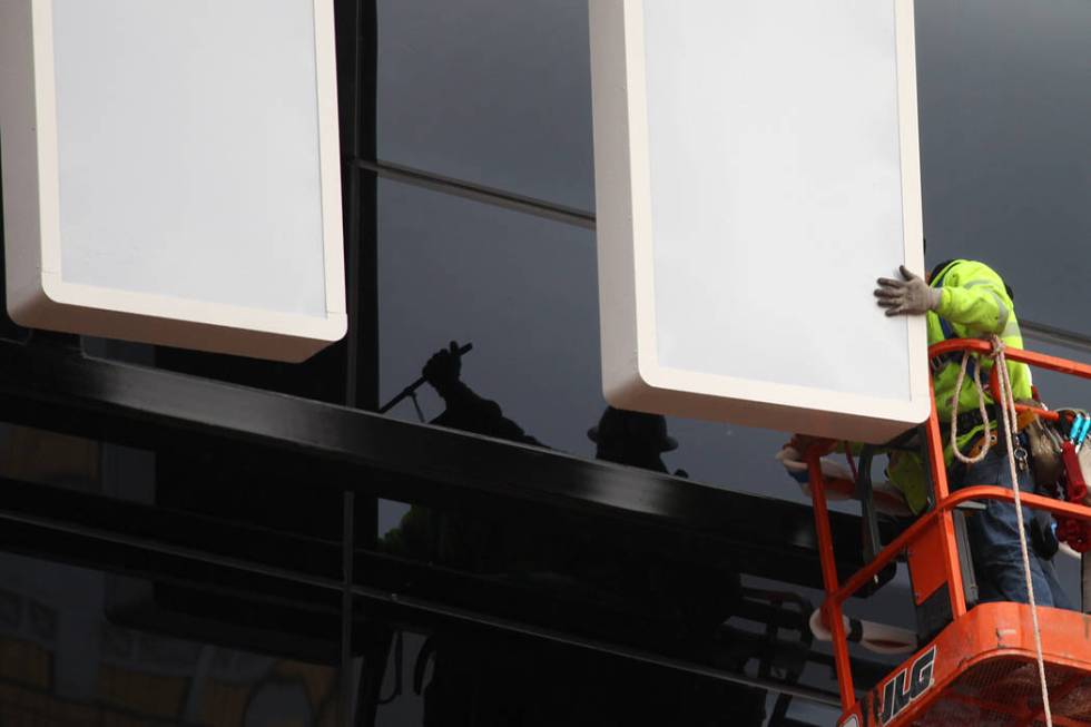 The last letter in the signage for the Raiders Allegiant Stadium logo is installed, in Las Vega ...