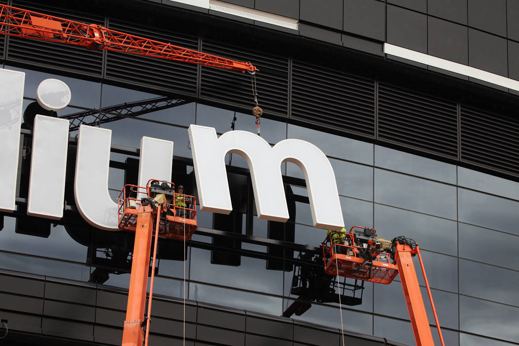 The last letter in the signage for the Raiders Allegiant Stadium logo is installed, in Las Vega ...