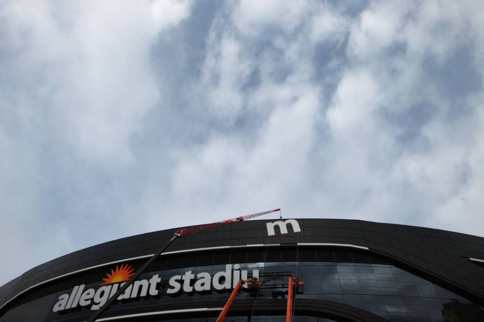 The last letter in the signage for the Raiders Allegiant Stadium logo is installed, in Las Vega ...