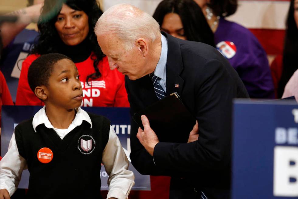 Democratic presidential candidate former Vice President Joe Biden, right, speaks with Deaunte B ...