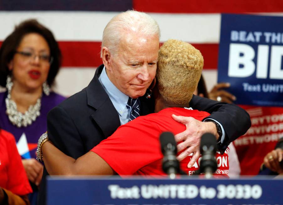 Democratic presidential candidate former Vice President Joe Biden hugs Crystal Turner of Columb ...