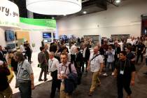 Conventioneers pour onto the show floor on the opening day of the National Association of Broad ...