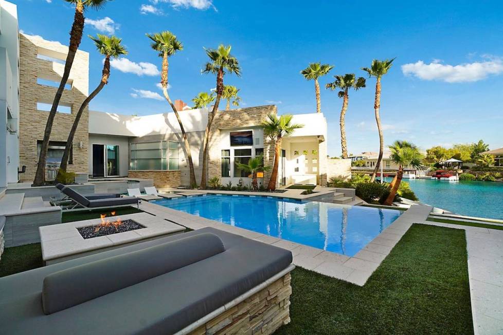 The home's backyard has a resort-style infinity-edge pool with Baja shelf and intimate entertai ...