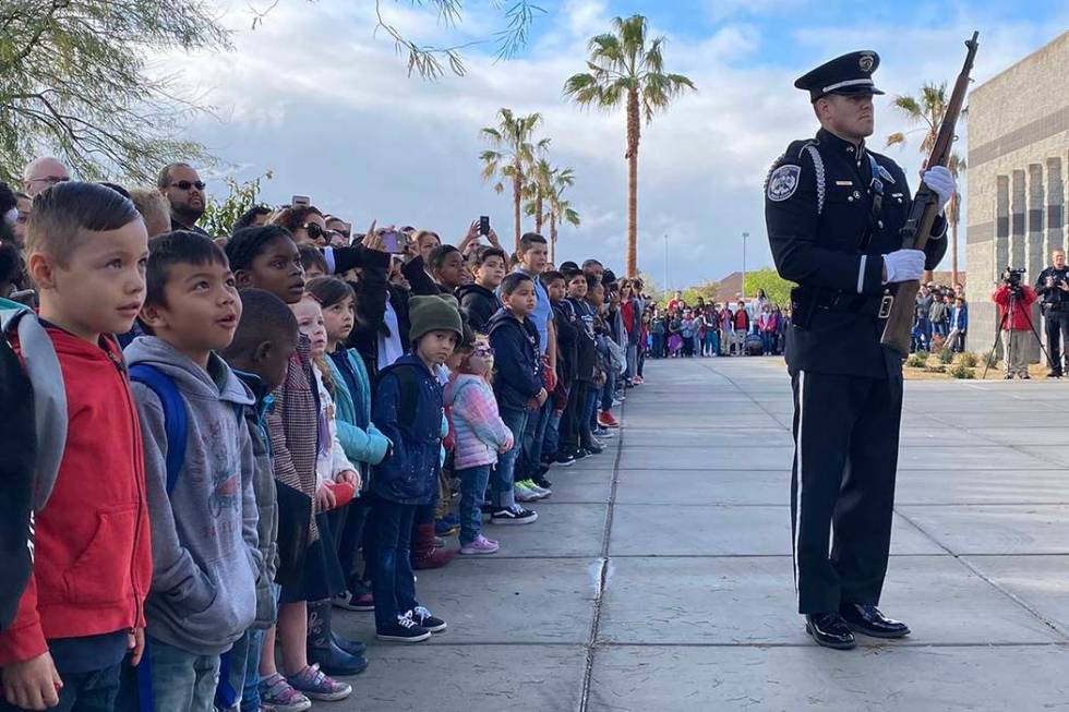 North Las Vegas Police Officer Guillermo Parra participates in honor guard ceremonies in front ...