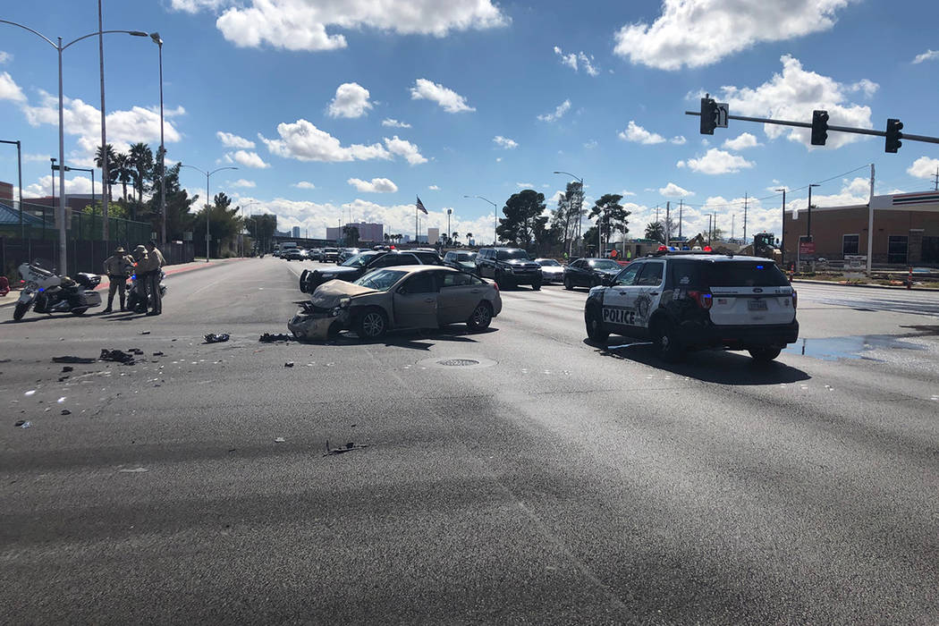 Police investigate a crash Wednesday, March 11, 2020, at the intersection of West Washington Av ...