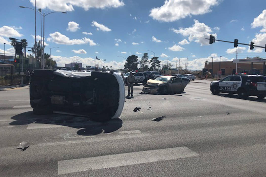 Police investigate a crash Wednesday, March 11, 2020, at the intersection of West Washington Av ...