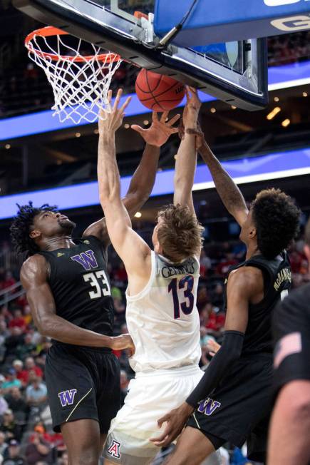 University of Washington's forward Isaiah Stewart (33) blocks a shot by University of Arizona's ...