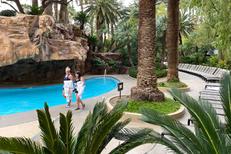 Guests walk along a pool at The Mirage on March 12, 2020, in Las Vegas. (K.M. Cannon/Las Vegas ...