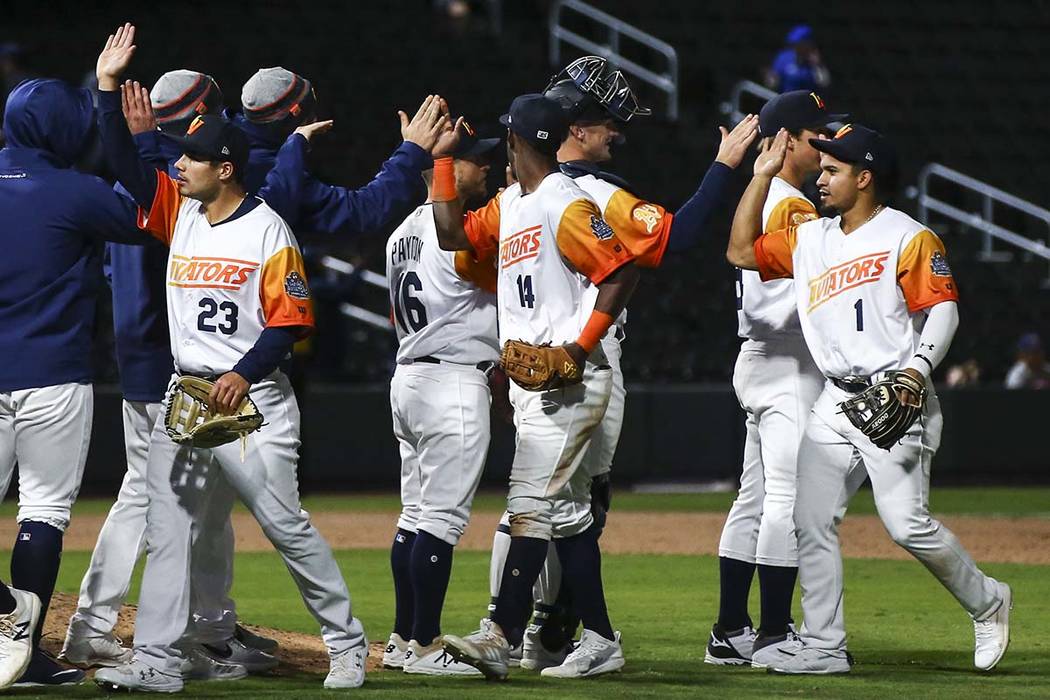 Las Vegas Aviators players celebrate a 10-2 win over the Sacramento River Cats in their home op ...