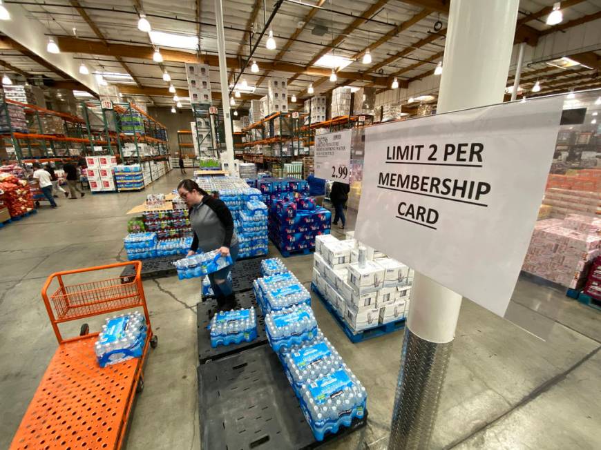 Shoppers, including Gisela Hernandez of Las Vegas, buy water at Costco at 222 S. Martin Luther ...