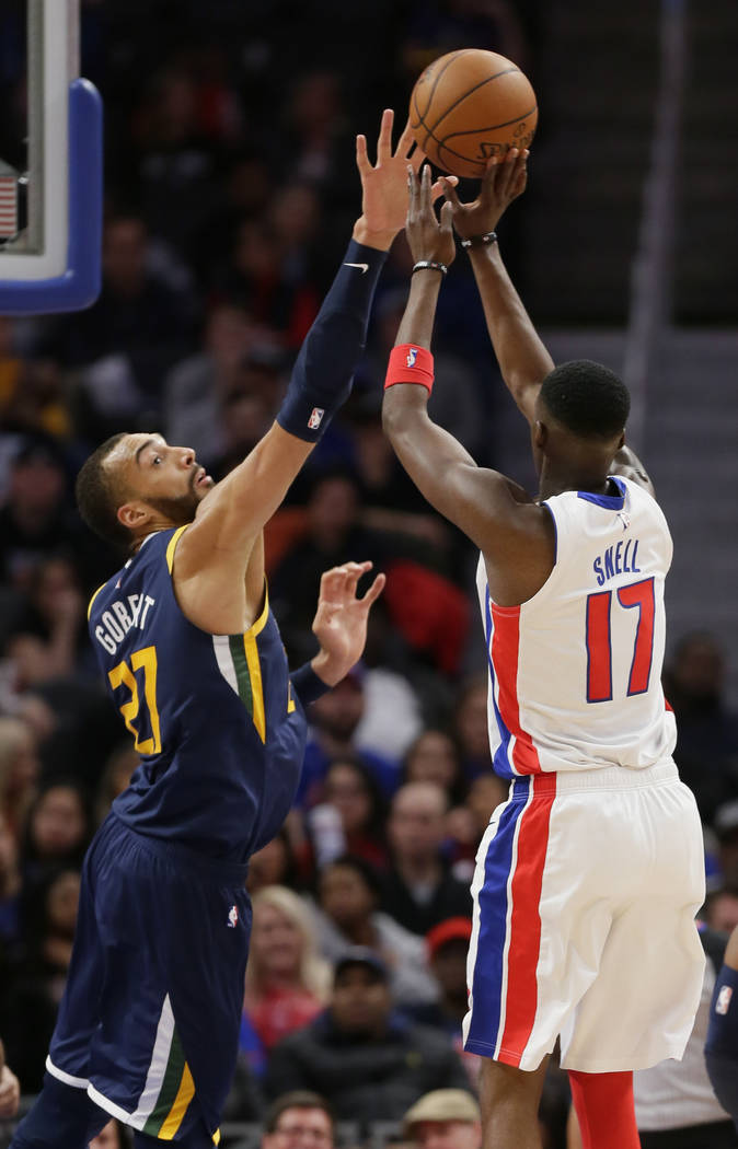 Utah Jazz center Rudy Gobert (27) defends against a shot by Detroit Pistons forward Tony Snell ...