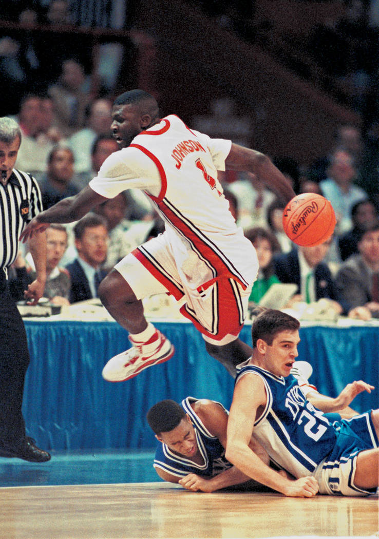 UNLV Rebels forward Larry Johnson (4) performs a behind the back pass during the NCAA Men's bas ...