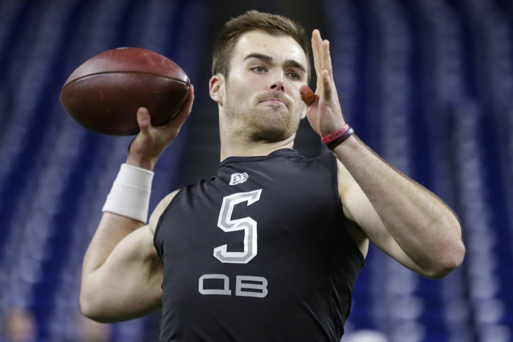 Georgia quarterback Jake Fromm runs a drill at the NFL football scouting combine in Indianapoli ...