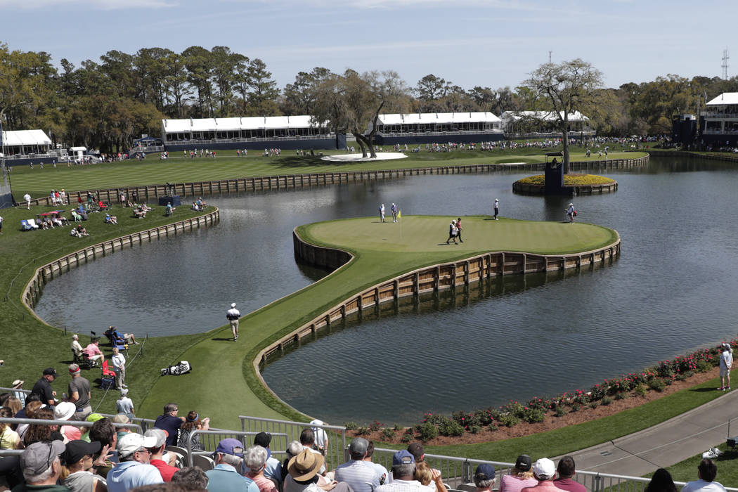 Cameron Champ, Nate Lashley, Kevin Tway and their caddies, walk the 17th green, during the firs ...