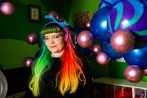 Balloon artist Tawney B. poses with her coronavirus balloons at her home in Las Vegas on Friday ...