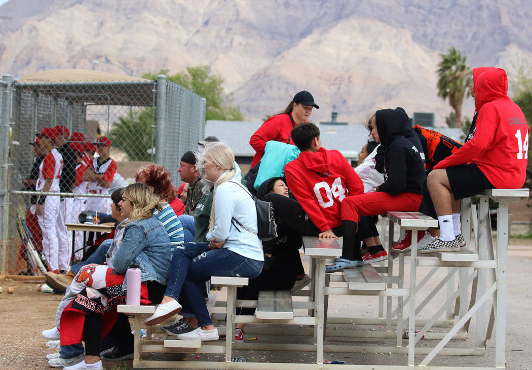 Parents and students watch a baseball game between Pahranagat Valley High School and Lincoln Co ...