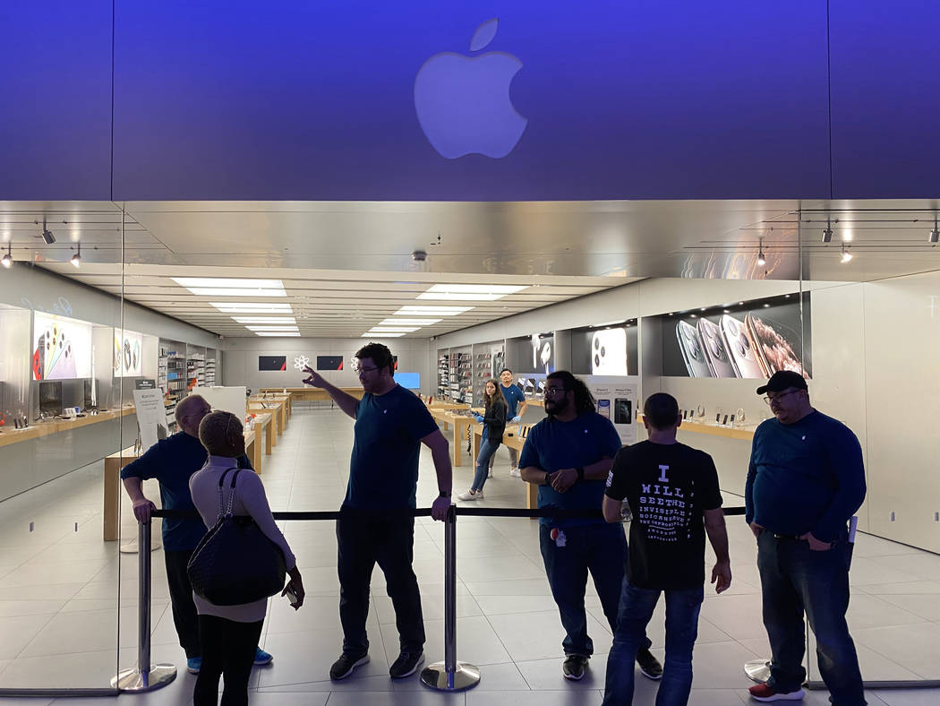 Shoppers inquire about the closing of Apple The Forum Shops due to concerns about the transmiss ...