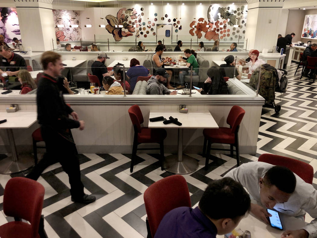 Visitors dine at the Strat Cafe though numbers are down due to the coronavirus pandemic on Satu ...